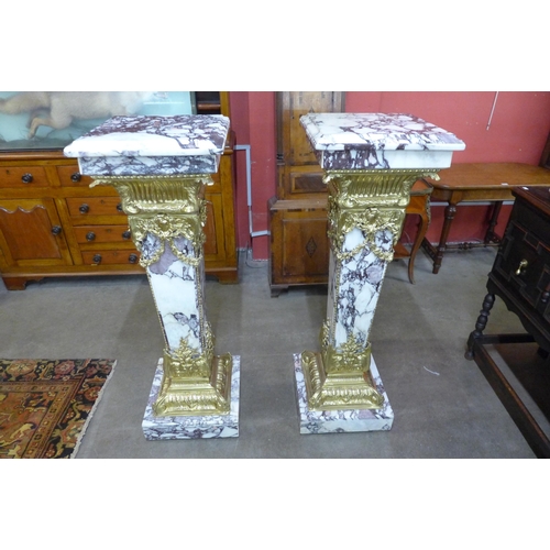 33 - A pair of large French style marble and gilt metal mounted pedestals