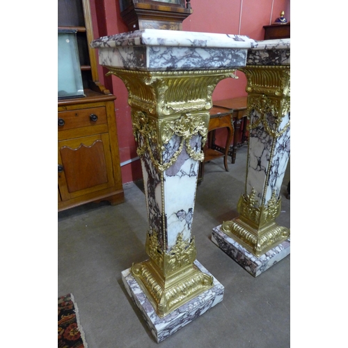 33 - A pair of large French style marble and gilt metal mounted pedestals