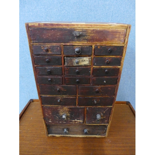 353 - A Victorian pine twenty drawer table top chest