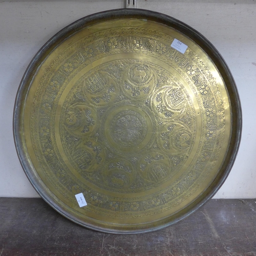 354 - A Persian brass circular plaque