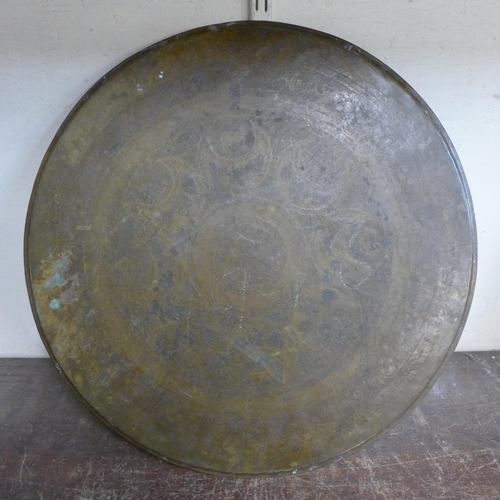 354 - A Persian brass circular plaque