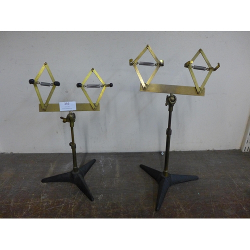 356 - A pair of brass shoe shop stands