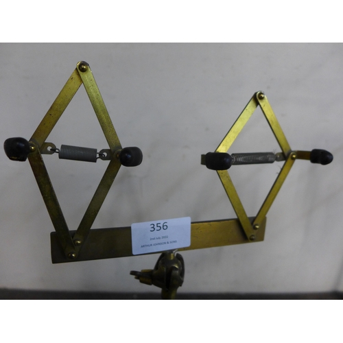 356 - A pair of brass shoe shop stands