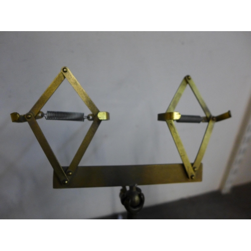 356 - A pair of brass shoe shop stands