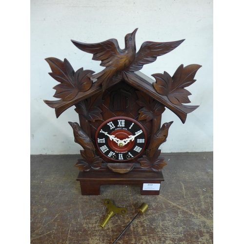 359 - A German carved cuckoo clock