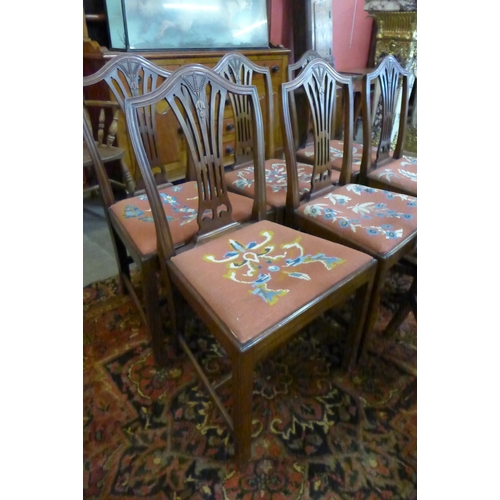 36 - An early 20th Century set of seven mahogany dining chairs in the Hepplewhite style with needlework d... 