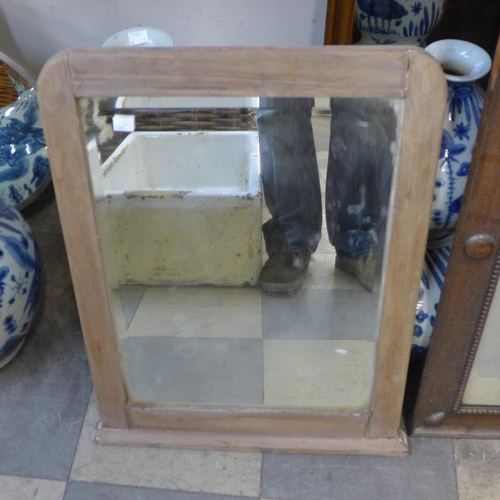 369 - An oak framed mirror and another