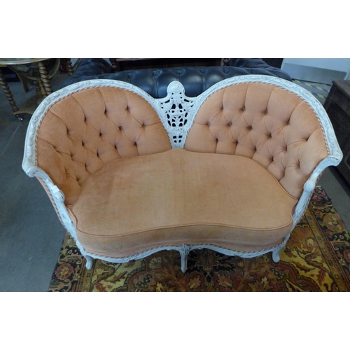 37 - A French style painted beech and fabric upholstered lovers canape settee