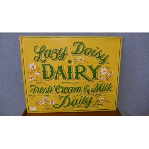 392 - A painted wooden Lazy Daisy Dairy sign