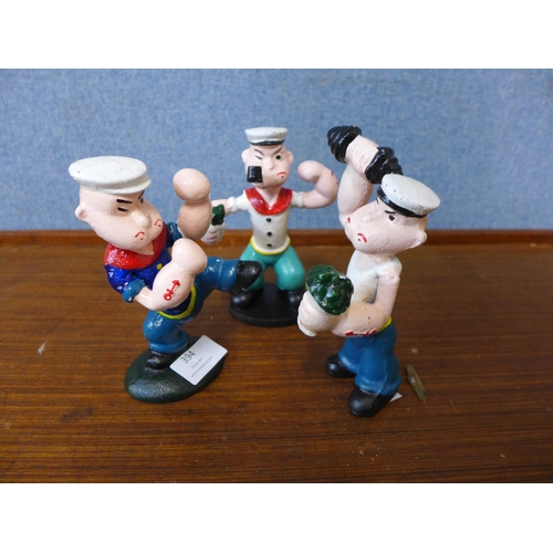 394 - Three cast iron Popeye figures