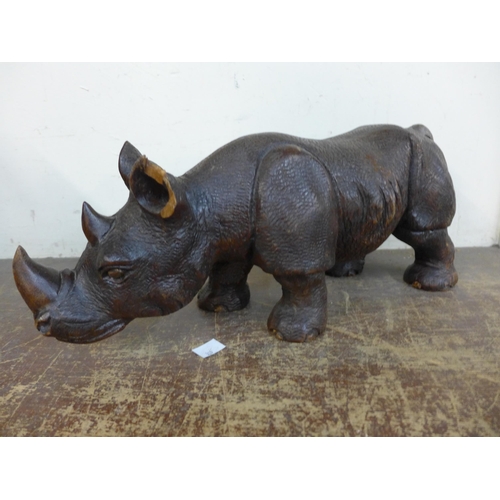 397 - A carved hardwood rhinoceros, a/f