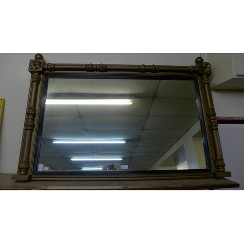 399 - A large ebonised and gilt framed overmantel mirror