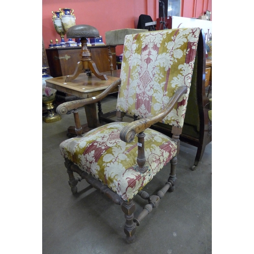 47 - A French carved walnut and fabric upholstered fauteuil armchair