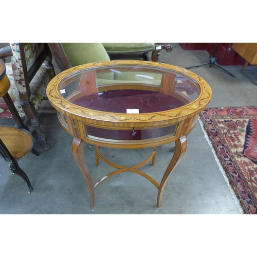 49 - A Victorian Sheraton Revival painted satinwood oval bijouterie table