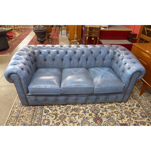 5 - A blue leather Chesterfield settee