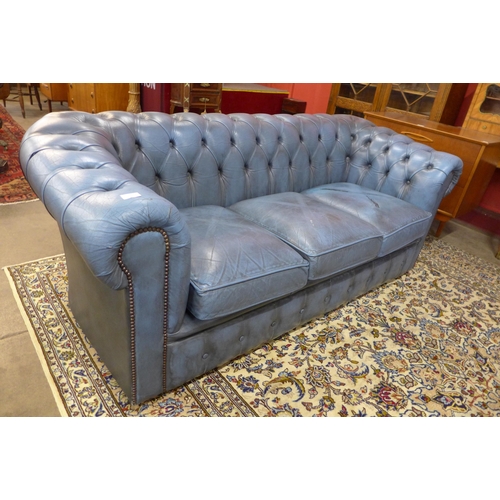 5 - A blue leather Chesterfield settee