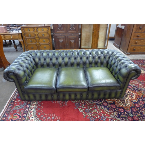 50 - A green leather Chesterfield settee