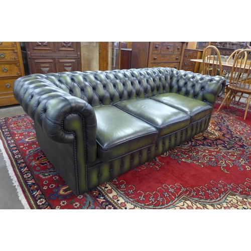 50 - A green leather Chesterfield settee