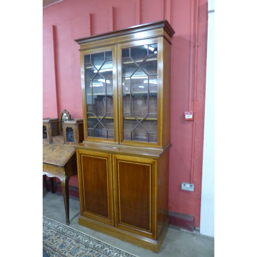 6 - An Edward VII inlaid mahogany bookcase