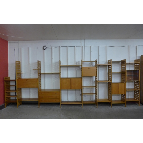 61 - A Staples teak eight bay Ladderax modular room divider