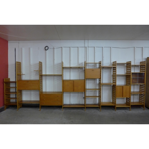 61 - A Staples teak eight bay Ladderax modular room divider