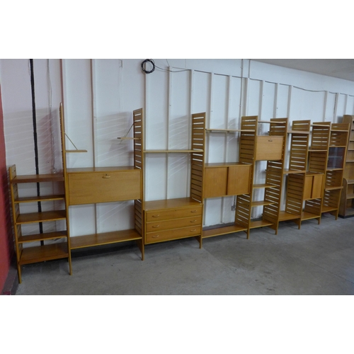 61 - A Staples teak eight bay Ladderax modular room divider