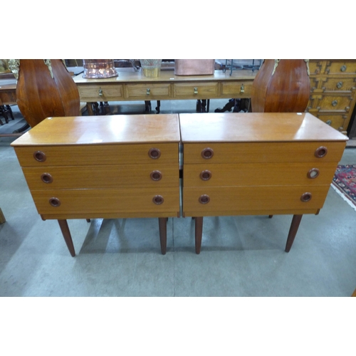 79 - A pair of teak chests of drawers