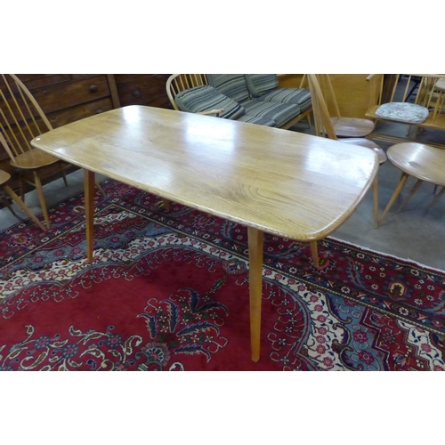 85 - An Ercol Blonde elm and beech 382 model plank dining table