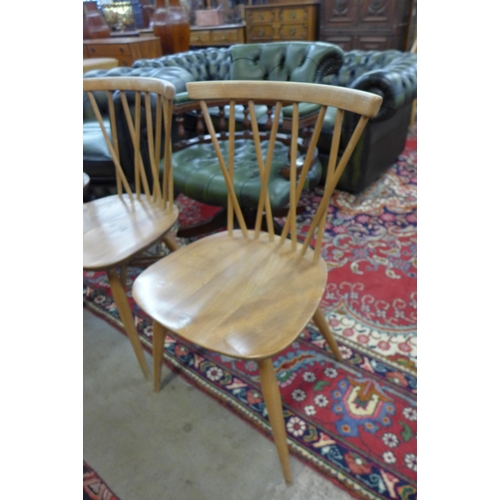 87 - A set of three Ercol Blonde elm and beech model 376 Candlestick Lattice dining chairs