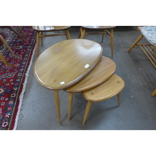 88 - An Ercol Blonde elm and beech pebble shaped nest of tables