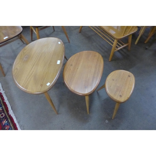 88 - An Ercol Blonde elm and beech pebble shaped nest of tables