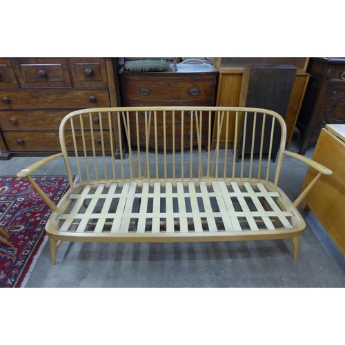 89 - An Ercol Blonde beech Windsor sofa