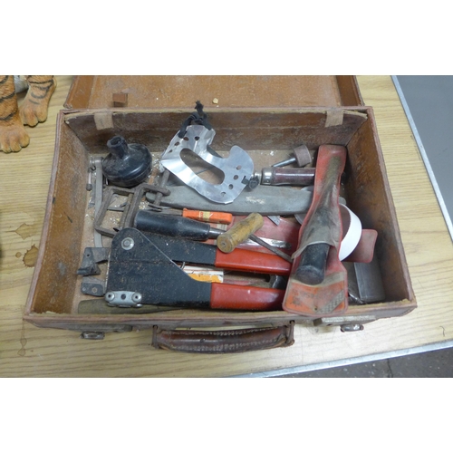 2211 - Small vintage suitcase of tools with wooden figure and pot tiger