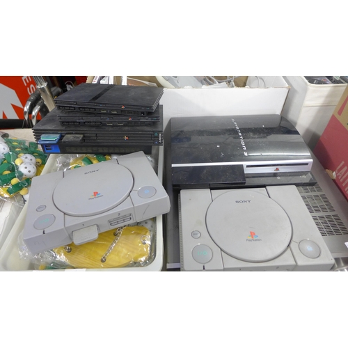 2282 - 2 PS1 Playstation consoles, PS2 consoles and a PS3 console plus leads, controllers and 28 games