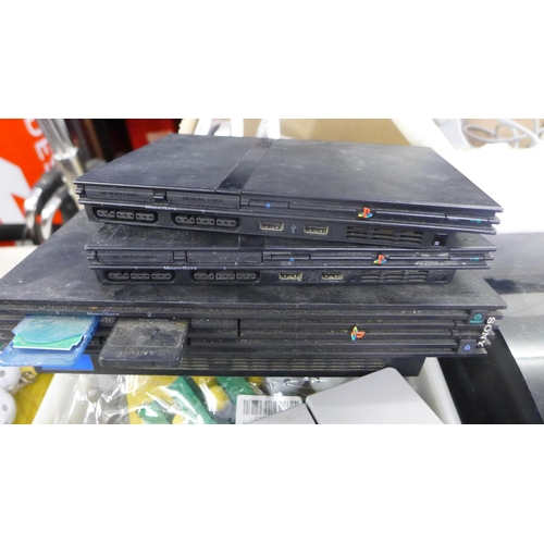 2282 - 2 PS1 Playstation consoles, PS2 consoles and a PS3 console plus leads, controllers and 28 games