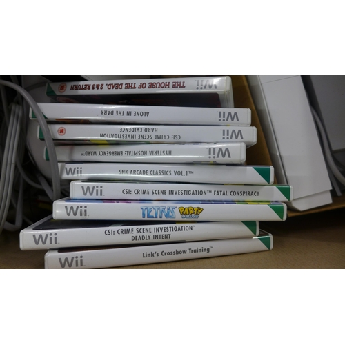 2292 - Two Wii consoles, Wii Fit board, accessories and approx. 10 games