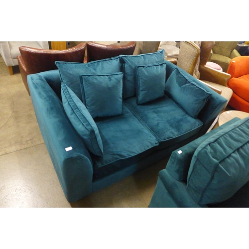 1381 - A sea green velvet two seater sofa