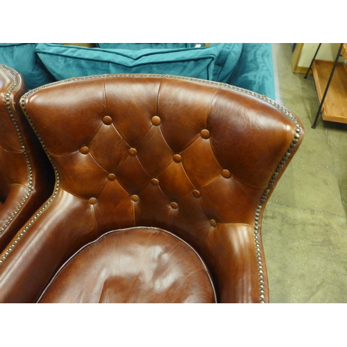 1392 - A pair of Stanford Oliato hazel leather button back and studded chairs - scuffed