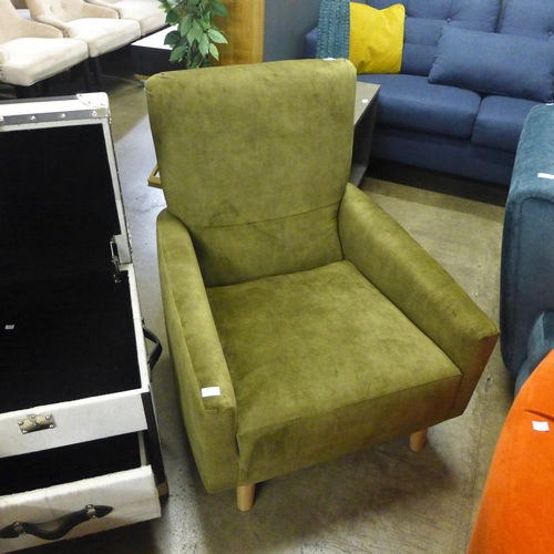 1414 - A green velvet upholstered armchair