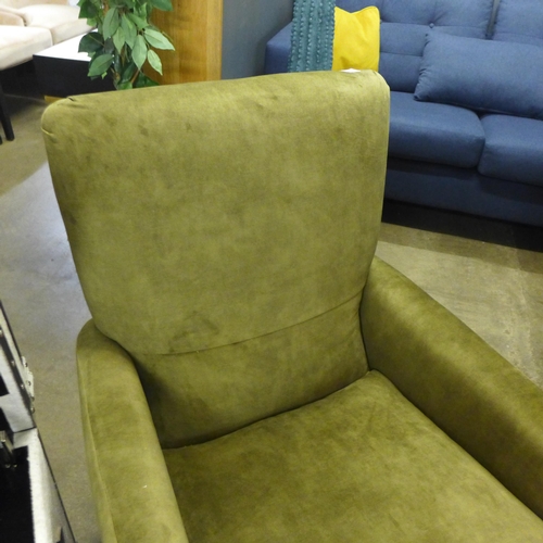 1414 - A green velvet upholstered armchair