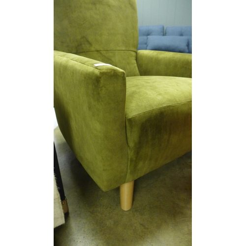 1414 - A green velvet upholstered armchair