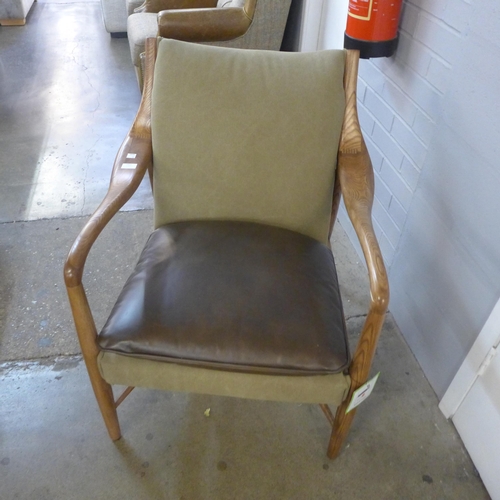 1451 - A Salisbury oak and leather leisure chair - repaired