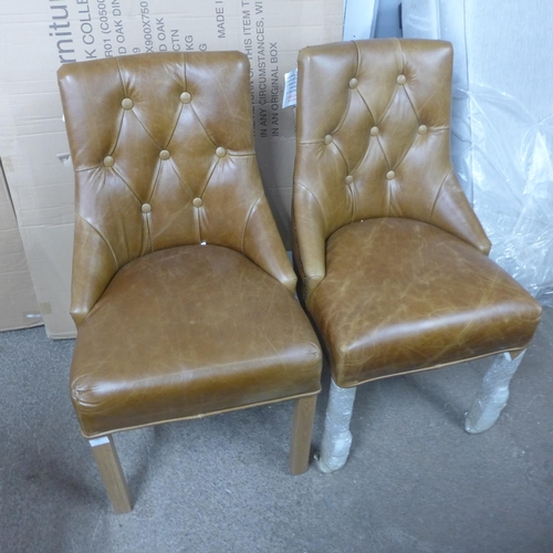 1489 - A pair of Stanton aniline leather button back and studded chairs