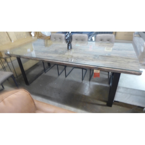 1493 - A Phoenix glass top and black steel dining table