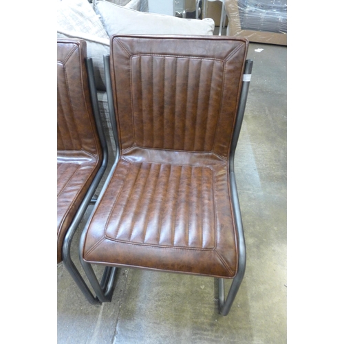 1536 - A Ribbed hardwood and gunmetal dining table with a set of six Novo chestnut chairs