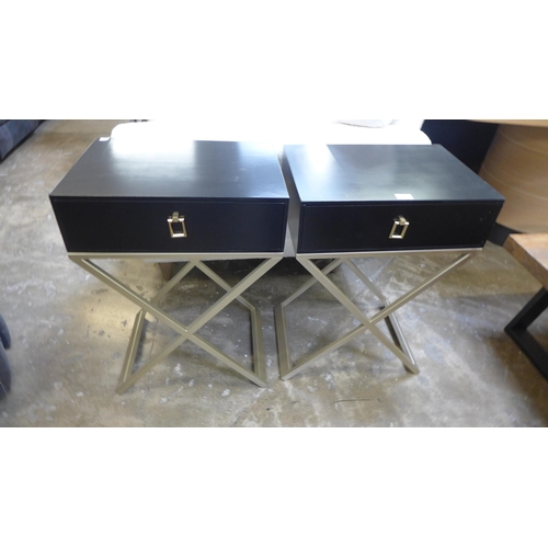 1553 - A pair of black bedside tables with cross legs