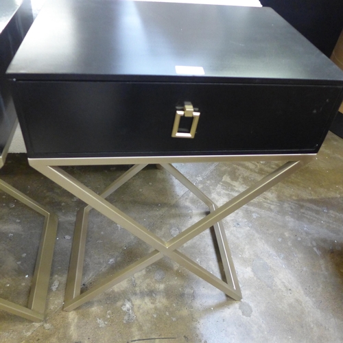 1553 - A pair of black bedside tables with cross legs