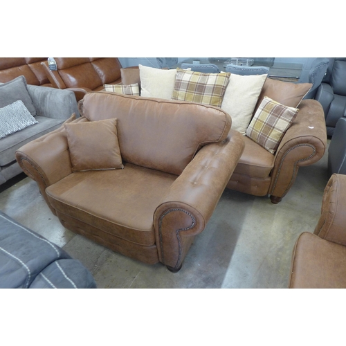 1557 - A County brown faux leather button back and studded four seater sofa and loveseat