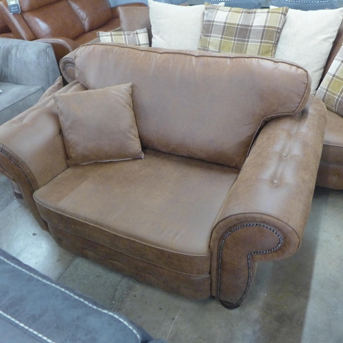 1557 - A County brown faux leather button back and studded four seater sofa and loveseat