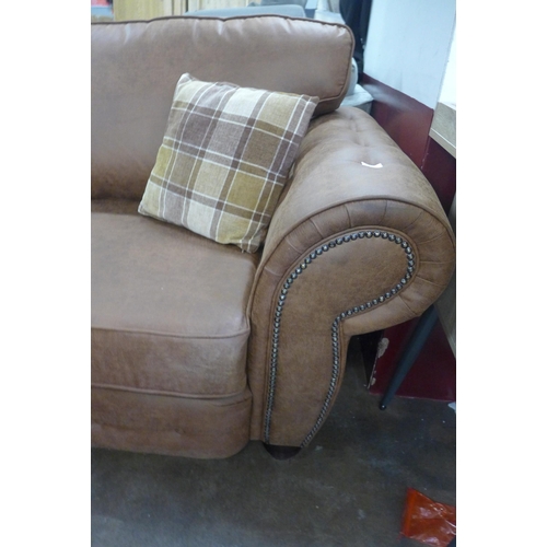 1558 - A County brown faux leather button back and studded three seater sofa and loveseat